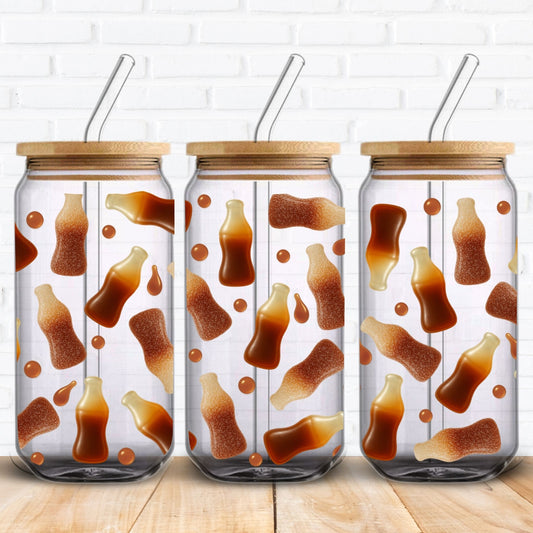 Cola bottle sweet-themed glass can wrap PNG for 16oz Libbey cups. Includes realistic fizzy sugar granule textures and syrupy cola drops for a nostalgic UK candy shop vibe. Great for sublimation and UV DTF applications. Fun, retro-inspired style for summer drinkware or quirky personalised gifts.