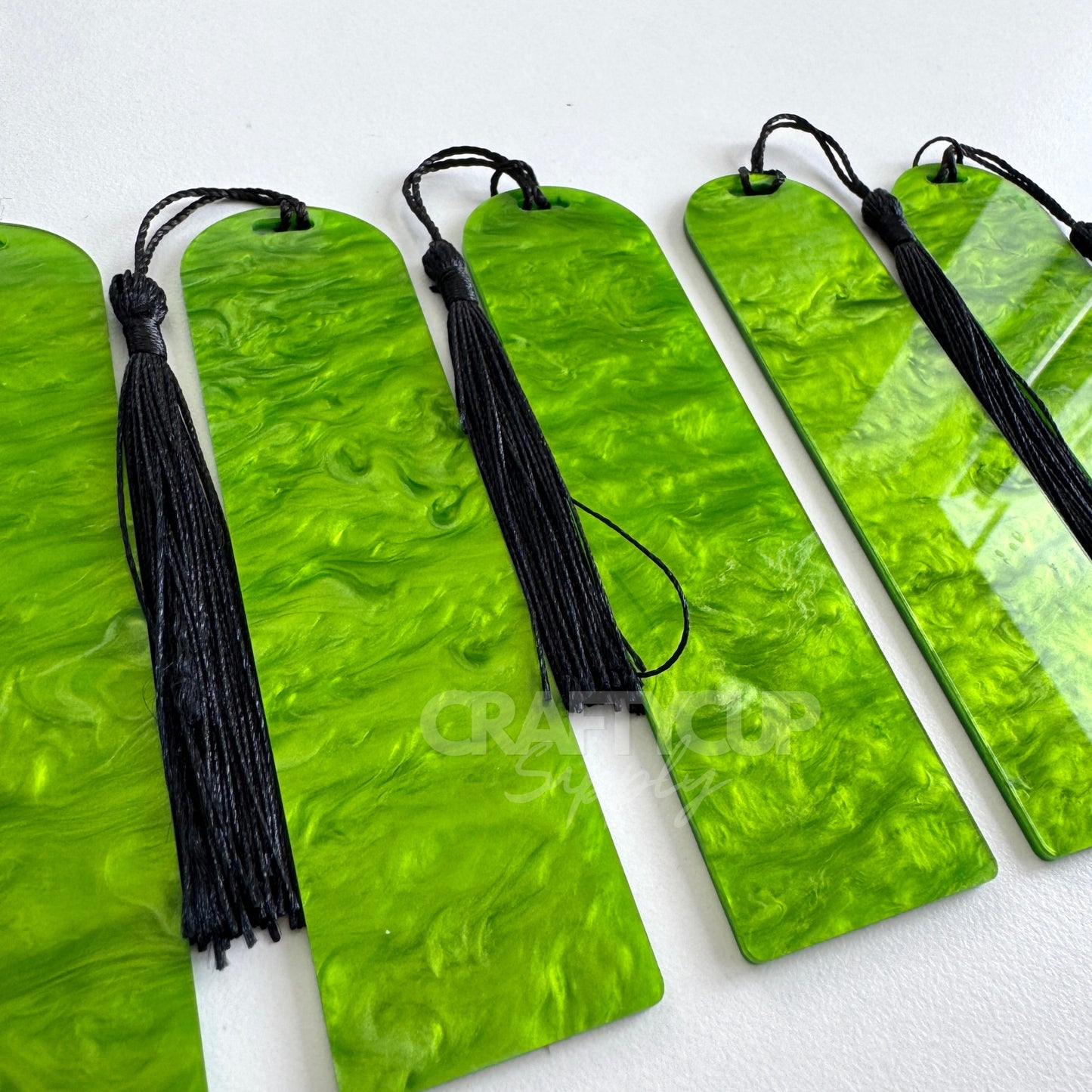 Oil slick swirl acrylic bookmark blank measuring 12x3.2cm with unique embedded pattern, clear finish, pre-cut hole, and included tassel – perfect for UV DTF and vinyl crafting.