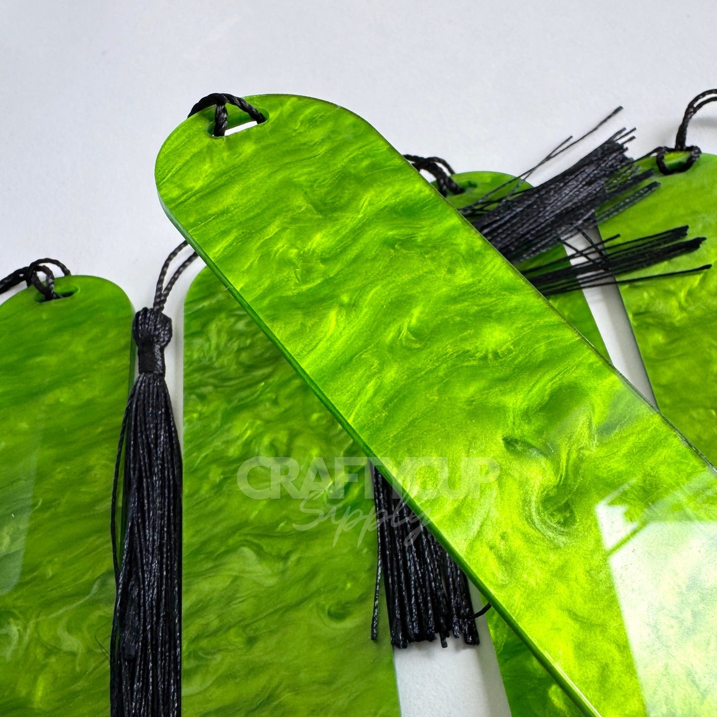 Oil slick swirl acrylic bookmark blank measuring 12x3.2cm with unique embedded pattern, clear finish, pre-cut hole, and included tassel – perfect for UV DTF and vinyl crafting.