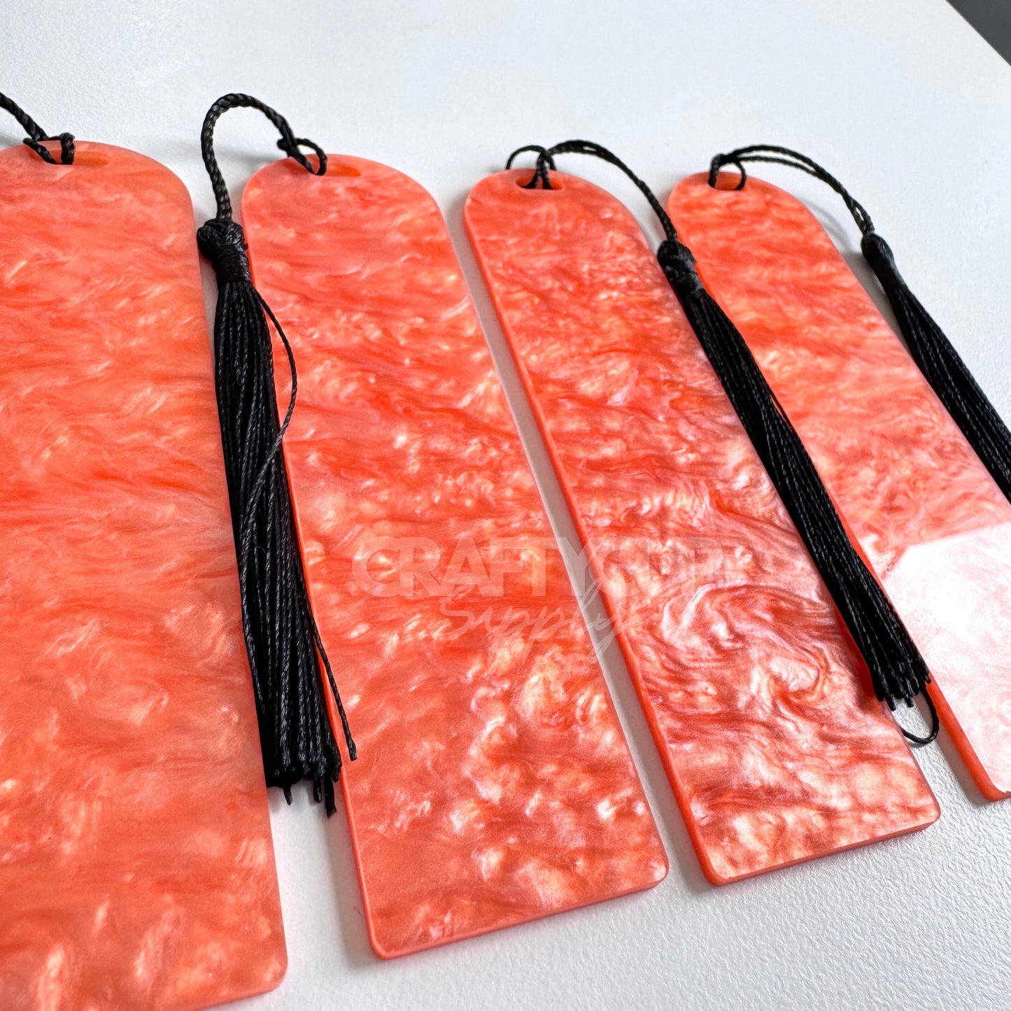 Oil slick swirl acrylic bookmark blank measuring 12x3.2cm with unique embedded pattern, clear finish, pre-cut hole, and included tassel – perfect for UV DTF and vinyl crafting.
