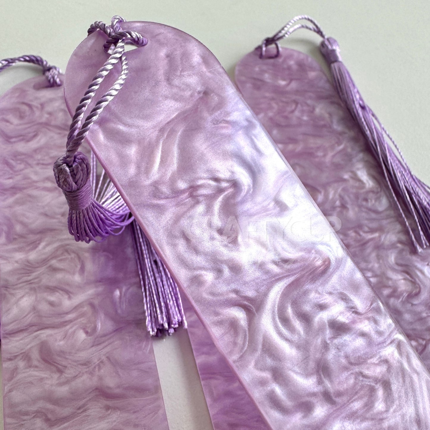 lilac Oil slick swirl acrylic bookmark blank measuring 12x3.2cm with unique embedded pattern, clear finish, pre-cut hole, and included tassel – perfect for UV DTF and vinyl crafting.