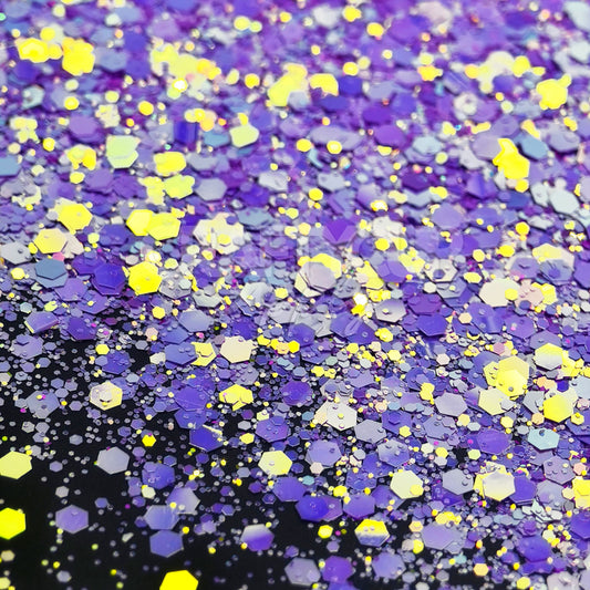 Lavender and lilac chunky glitter blend with yellow iridescent accents, heat-resistant and ideal for epoxy.