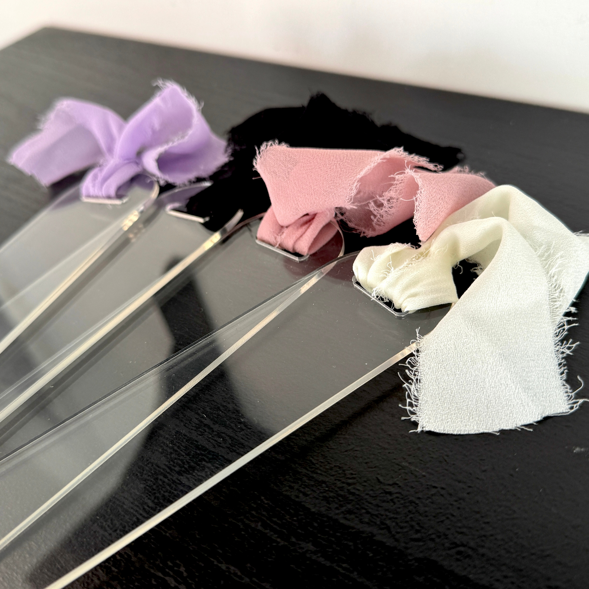 premium thick clear acrylic bookmarks with coquette colourful ribbon bow attached. Can be used for vinyl, uv dtf and more.