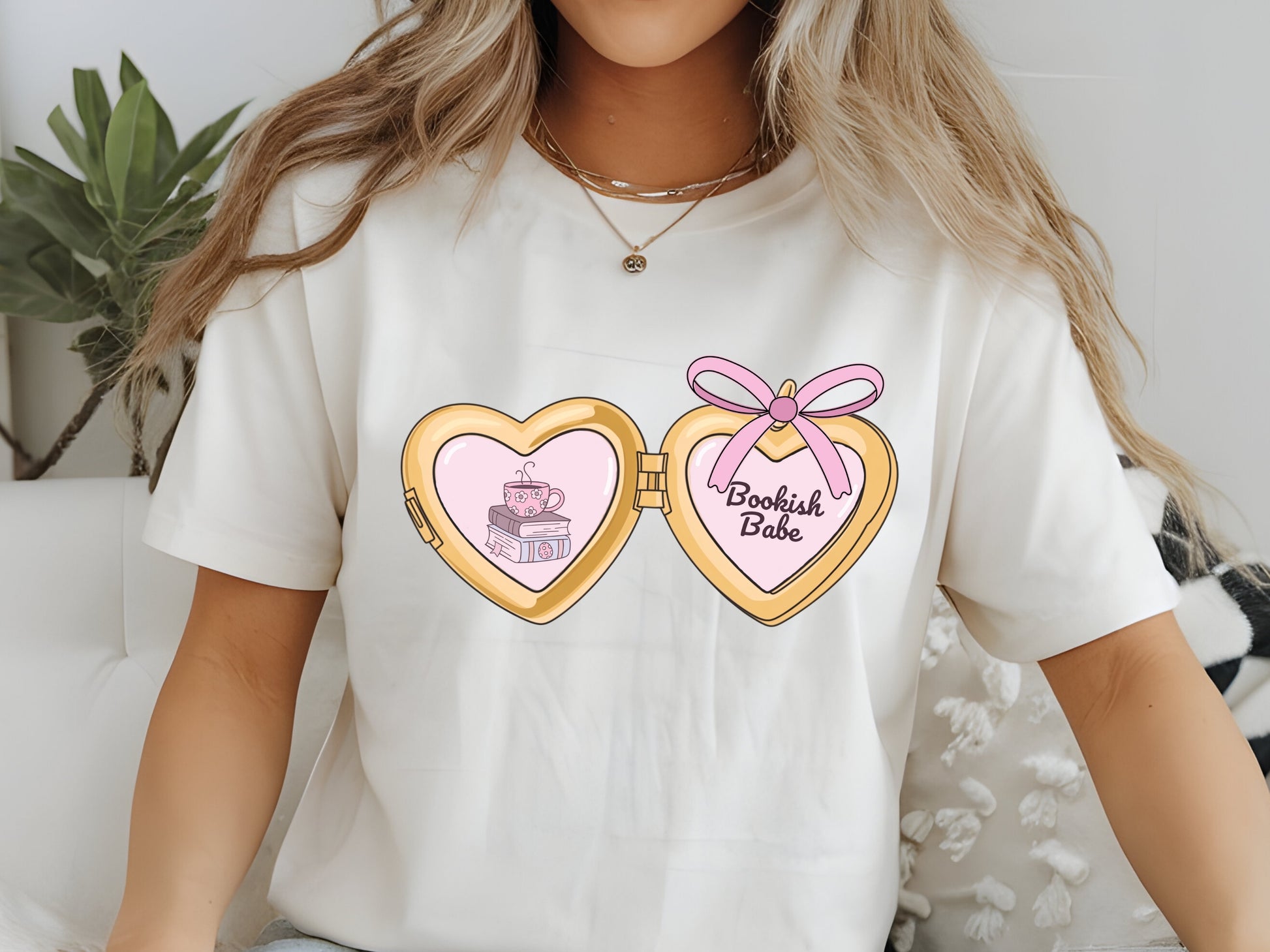 a cute trending and popular PNG digital download design of a gold love heart locket featuring bookish genres for book reading girls.  Can be used to create physical stickers or use for sublimation on clothing such as t shirts, jumpers and canvas bags