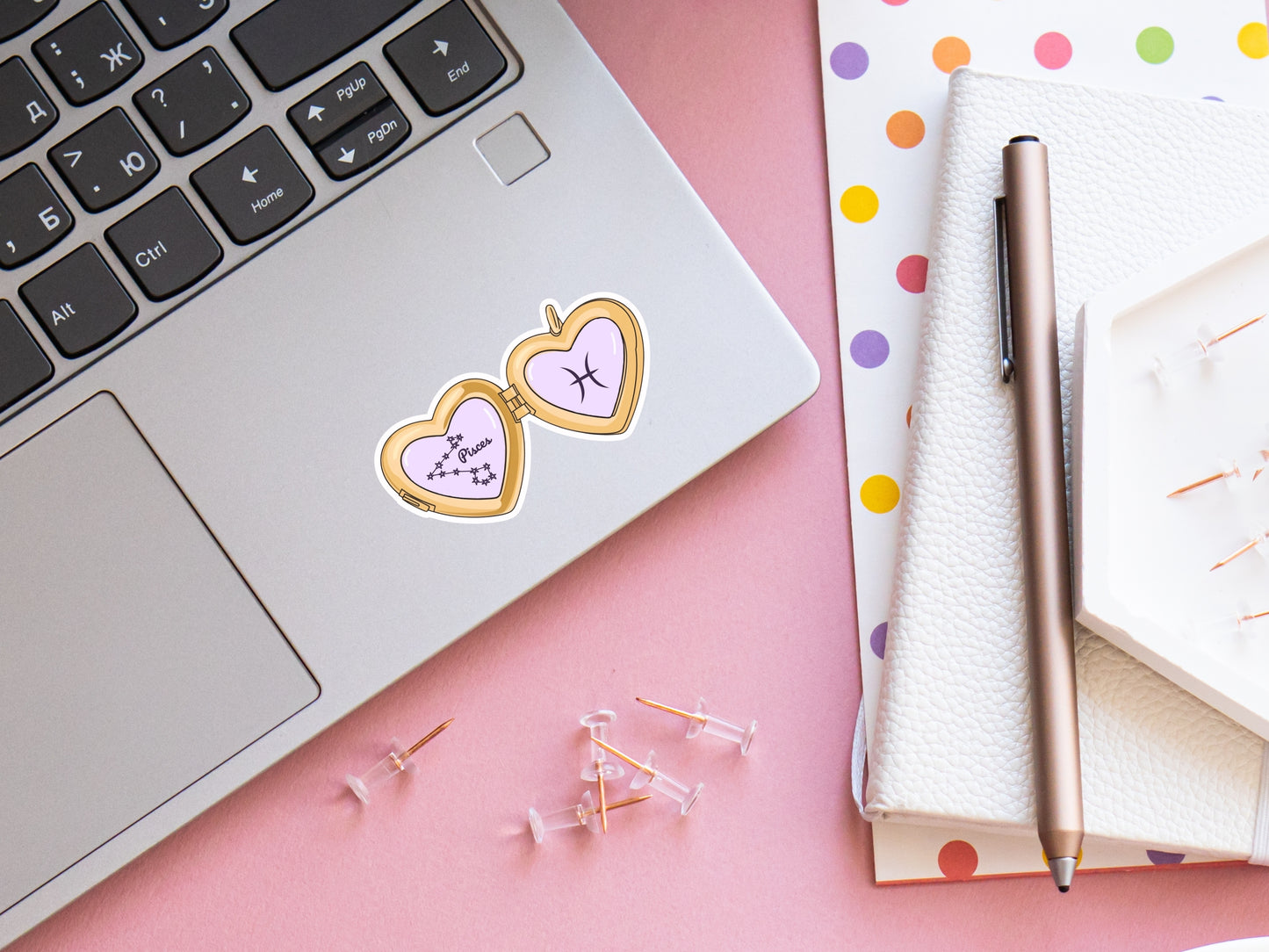 a cute trending and popular PNG digital download design of a gold love heart locket featuring a zodiac star sign and constellation symbol, finished with a purple lilac bow.  Can be used to create physical stickers or use for sublimation on clothing such as t shirts, jumpers and canvas bags