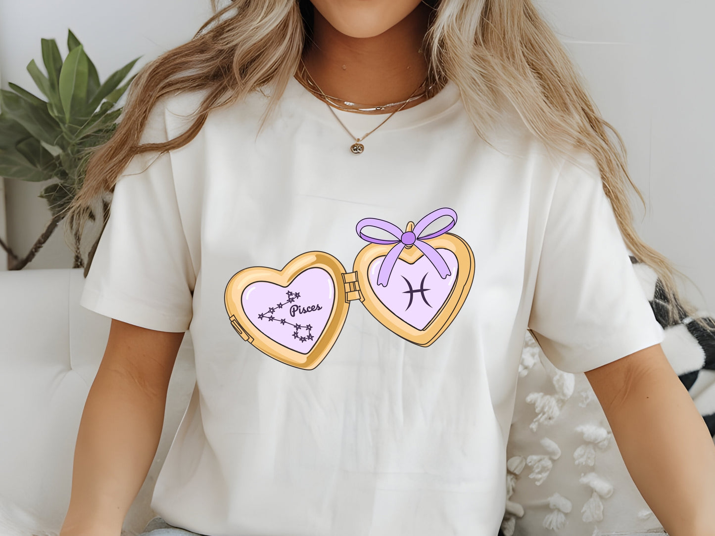 a cute trending and popular PNG digital download design of a gold love heart locket featuring a zodiac star sign and constellation symbol, finished with a purple lilac bow.  Can be used to create physical stickers or use for sublimation on clothing such as t shirts, jumpers and canvas bags