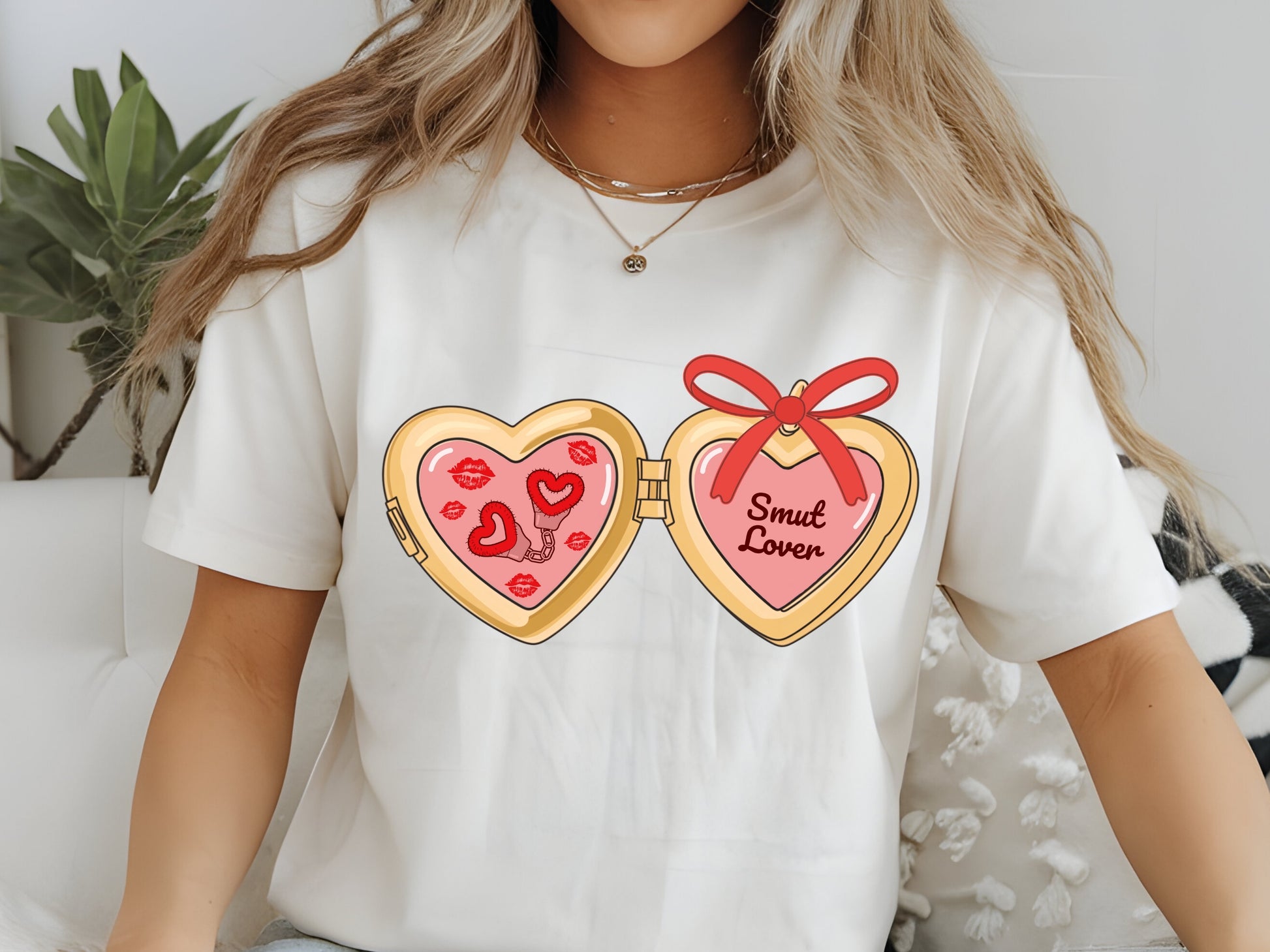 a cute trending and popular PNG digital download design of a gold love heart locket featuring bookish genres for book reading girls.  Can be used to create physical stickers or use for sublimation on clothing such as t shirts, jumpers and canvas bags