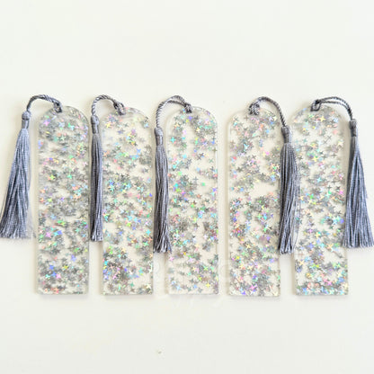 Clear acrylic bookmark blank filled with internal silver star glitter, measuring 12x3.2cm with a smooth finish, pre-cut hole, and tassel – perfect for UV DTF, vinyl, and custom designs.