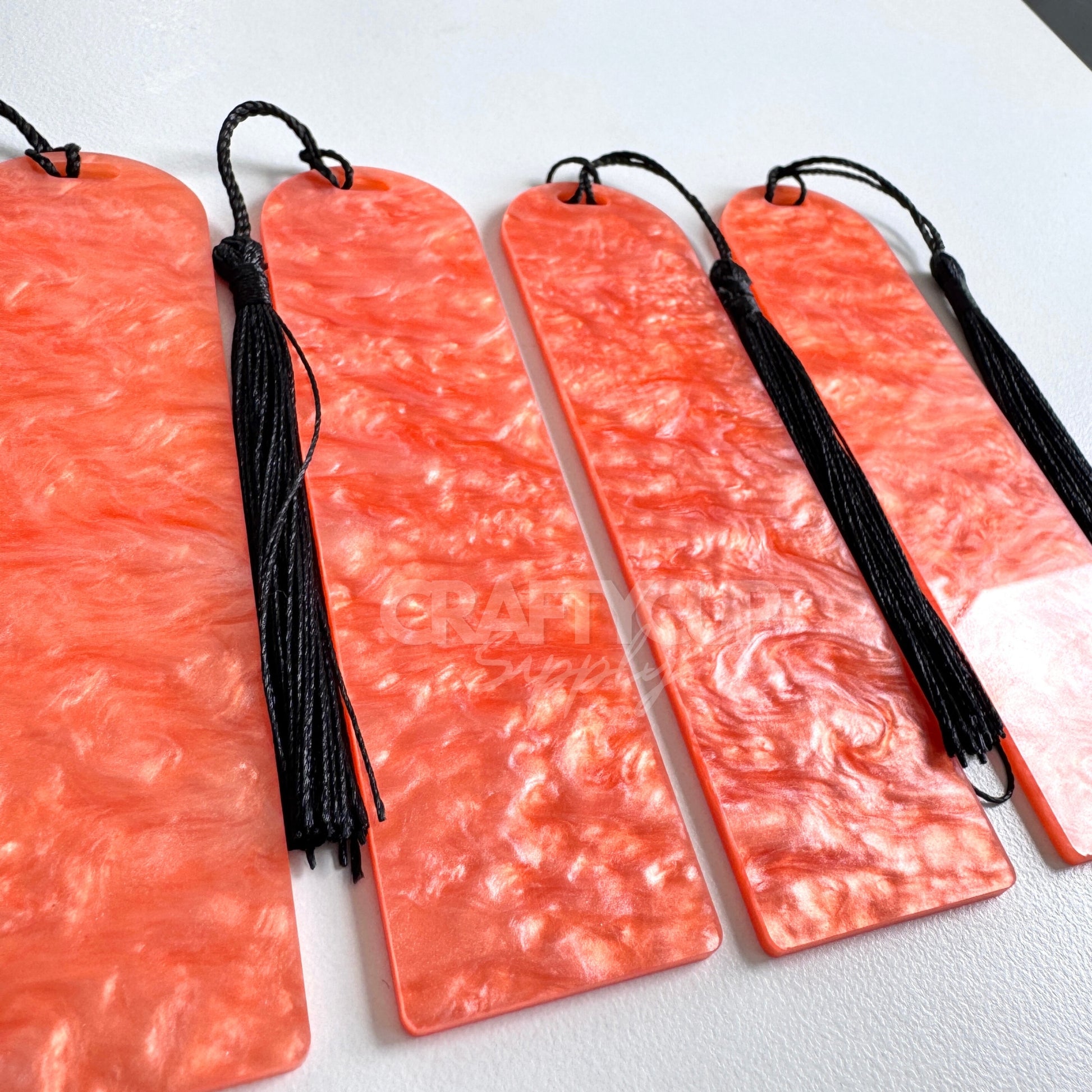Oil slick swirl acrylic bookmark blank measuring 12x3.2cm with unique embedded pattern, clear finish, pre-cut hole, and included tassel – perfect for UV DTF and vinyl crafting.