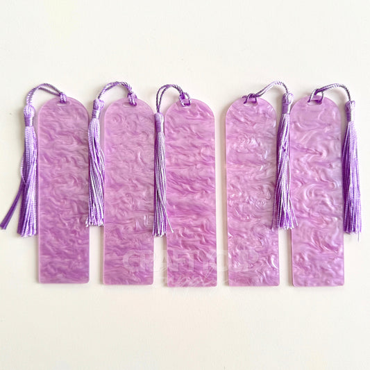 lilac Oil slick swirl acrylic bookmark blank measuring 12x3.2cm with unique embedded pattern, clear finish, pre-cut hole, and included tassel – perfect for UV DTF and vinyl crafting.