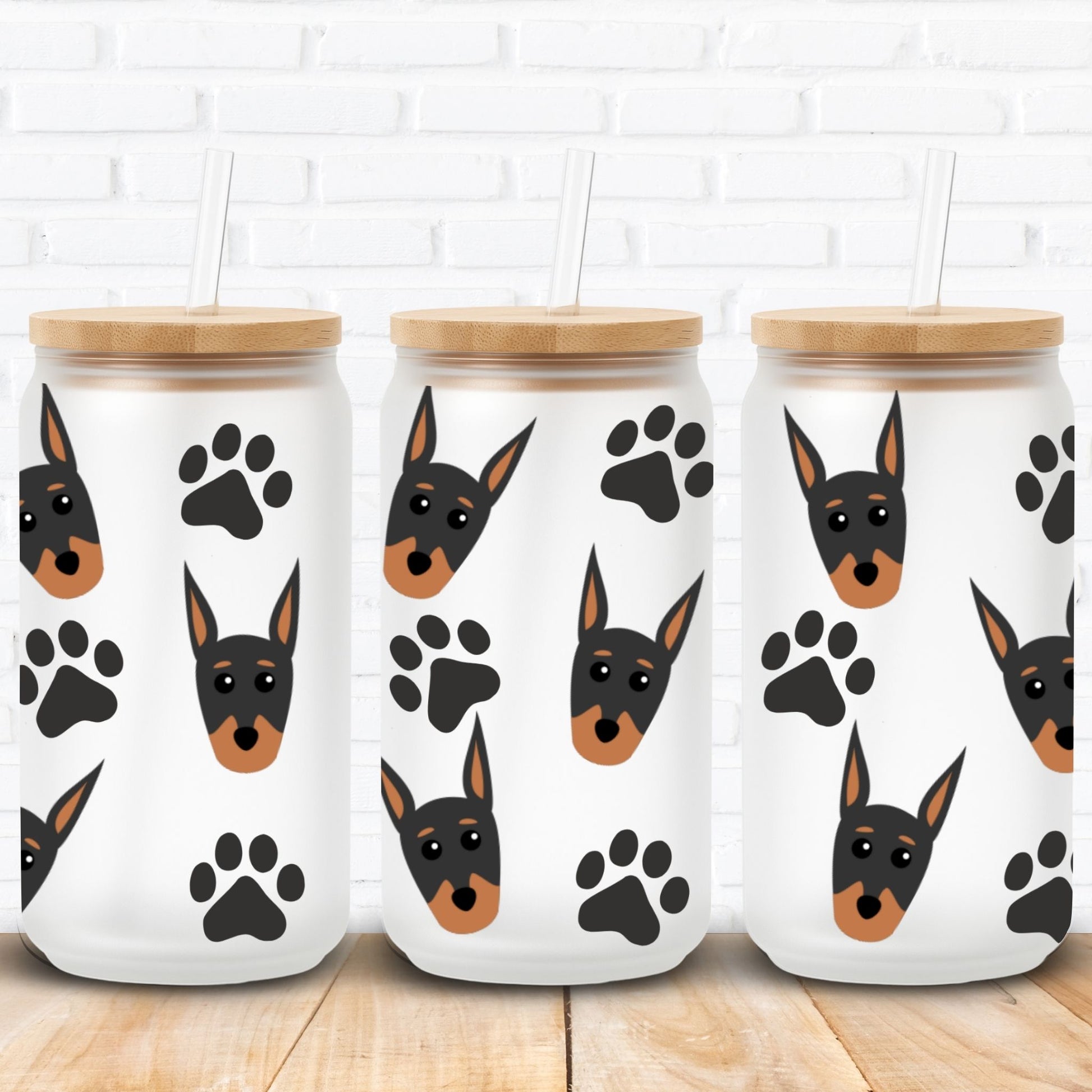 Three jars with dog illustrations and paw prints on a white brick wall background