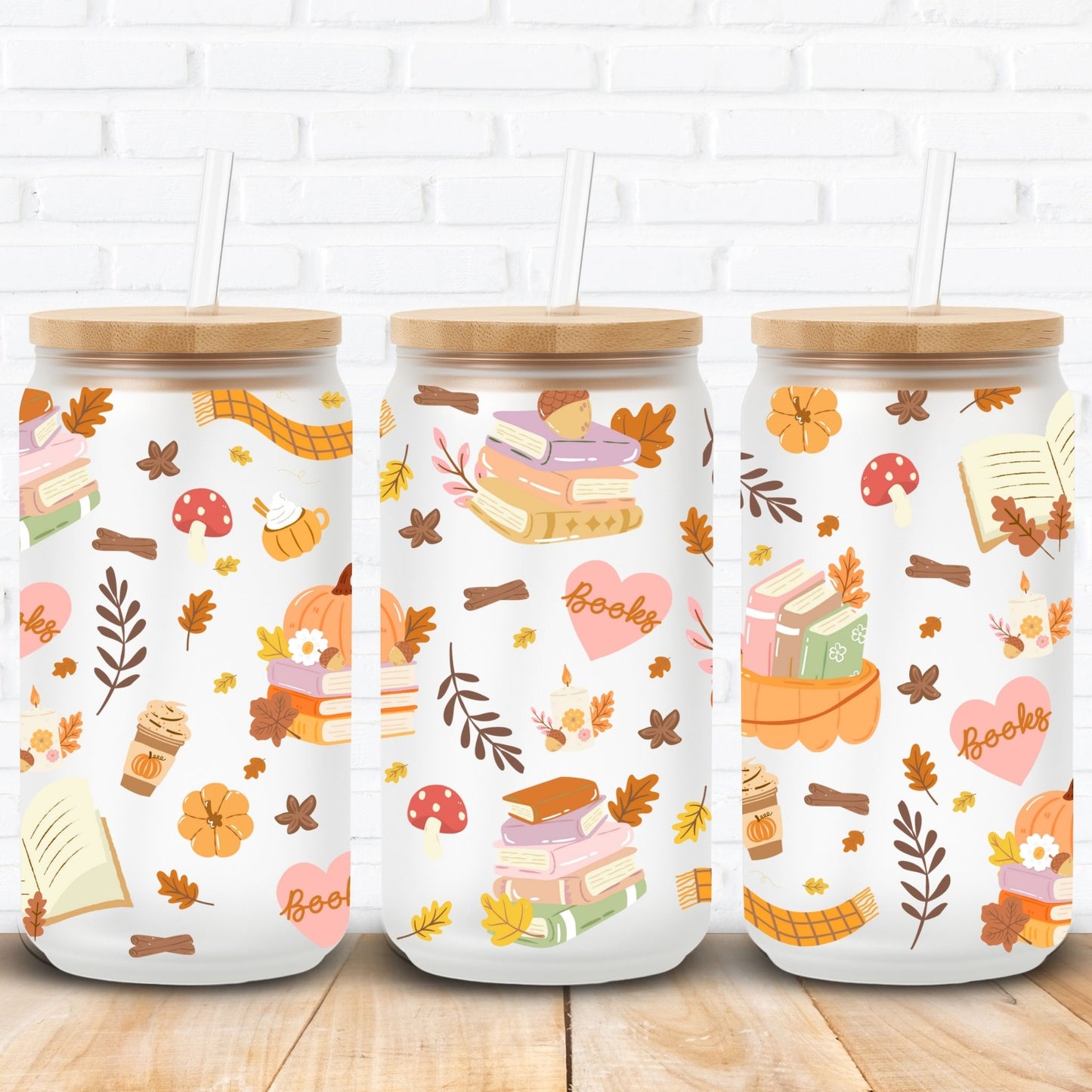 Autumn bookish sublimation wrap for 16oz and 20oz Libbey glass cans featuring cozy fall vibes with stacked books, pumpkins, candles, coffee cups, scarves, mushrooms, hearts with 'books' text, acorns, and autumn leaves. Seamless high-resolution PNG perfect for sublimation and UV DTF crafting. Ideal for book lovers, cozy reading season, fall décor, and pumpkin spice inspired glass can tumblers. Great gift for autumn readers and seasonal drinkware lovers.