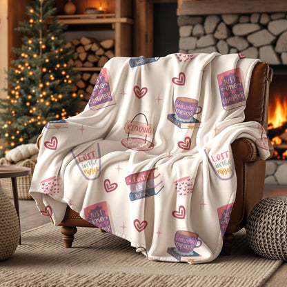 Cosy reading themed seamless pattern displayed on a blanket featuring romantic books, bookworm coffee cups, pastel hearts and cute reading quotes.