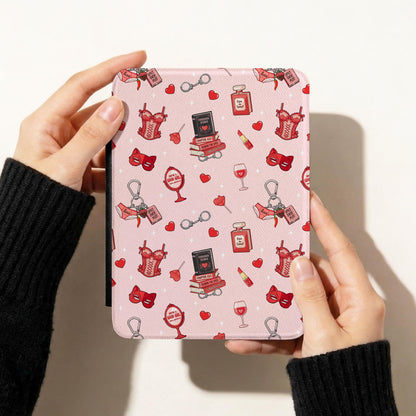 Spicy romance book lover digital paper design on a Kindle cover with red hearts, corsets, handcuffs, perfume and bookish illustrations.