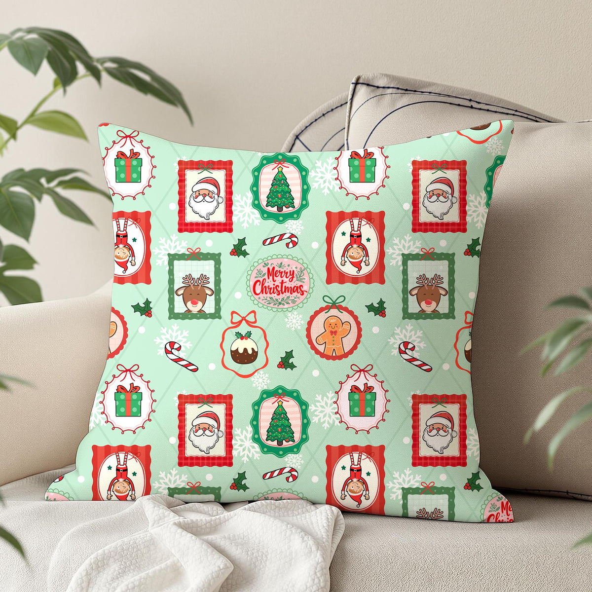 Christmas portrait frames seamless pattern on a decorative cushion featuring Santa, reindeer, elves and festive illustrations on mint green.