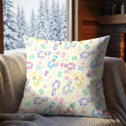 Pastel nutcracker Christmas seamless design on a decorative cushion featuring colourful toy soldiers, candy canes, hearts and sweets.