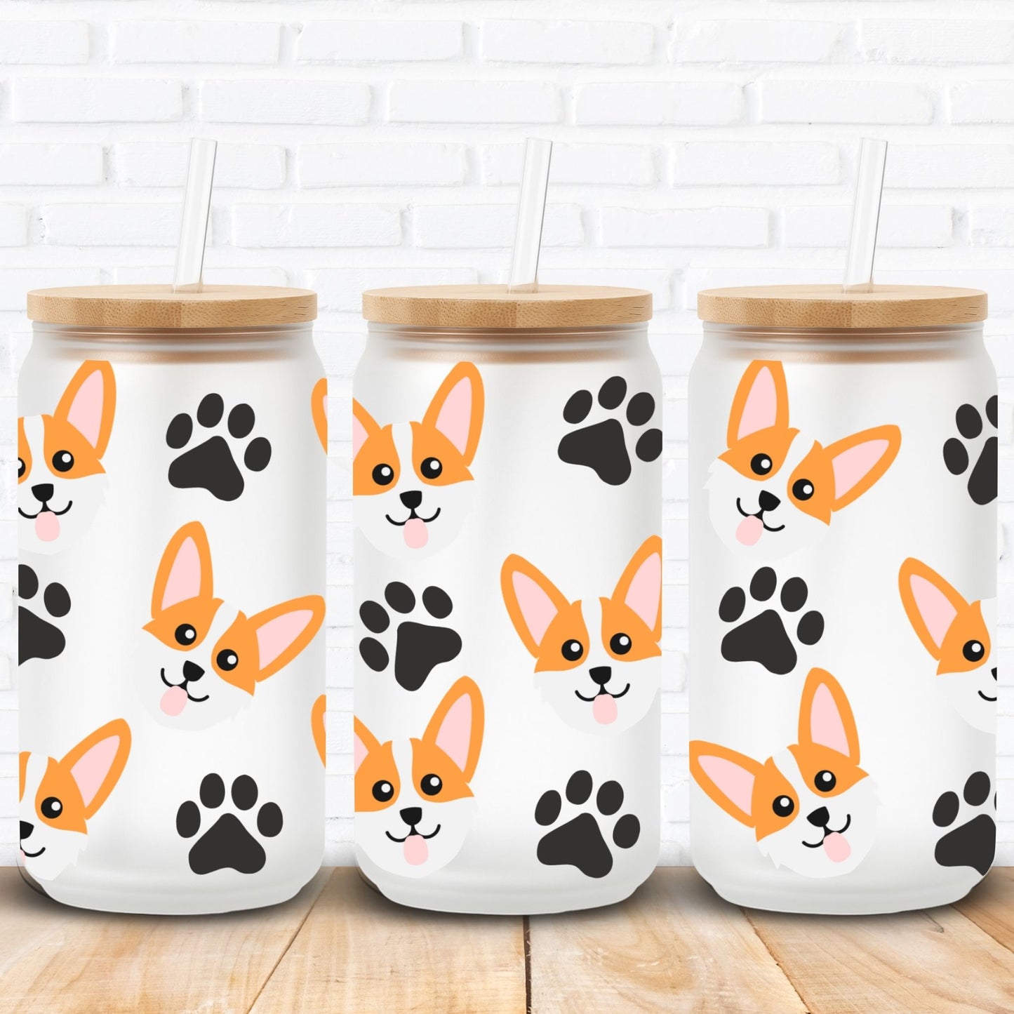 libbey glass cans with wooden lids featuring corgi dog illustrations and black paw prints on a white brick wall background.