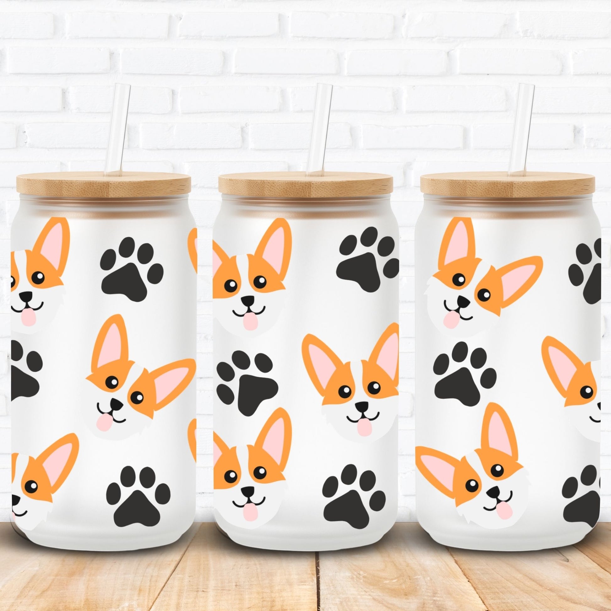 libbey glass cans with wooden lids featuring corgi dog illustrations and black paw prints on a white brick wall background.