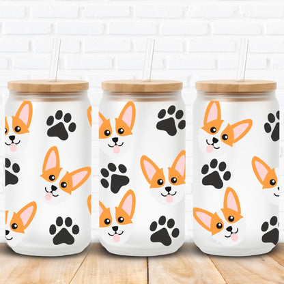 libbey glass cans with wooden lids featuring corgi dog illustrations and black paw prints on a white brick wall background.