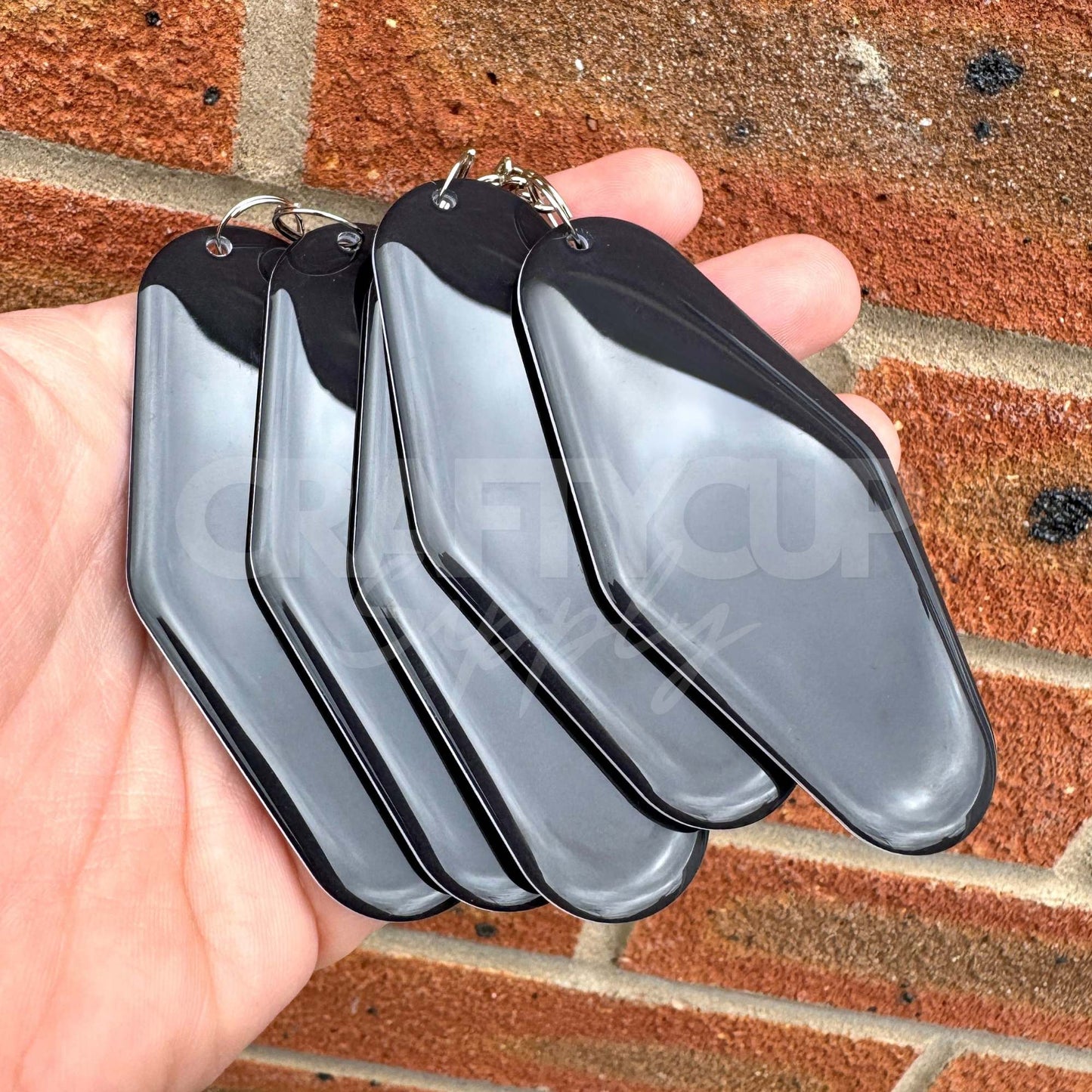 Black NFC motel shaped tag keyring designed for contactless digital business cards and payment links