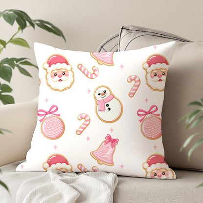 Cute pink Christmas seamless pattern on a decorative cushion featuring Santa cookies, snowman cookies, candy canes and pink Christmas ornaments.