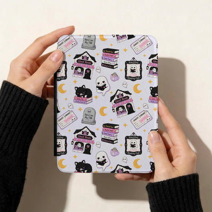 Spooky bookish seamless pattern displayed on a Kindle cover featuring cute reading ghosts, black cats, haunted bookshops and purple Halloween illustrations.