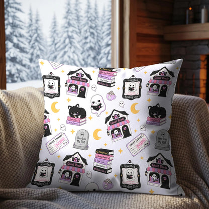 Cute spooky book lover seamless digital paper displayed on a decorative cushion with ghost reading club artwork, black cats and pastel Halloween books.