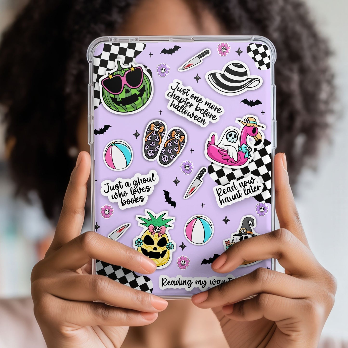 Phone case with colorful stickers held by a person