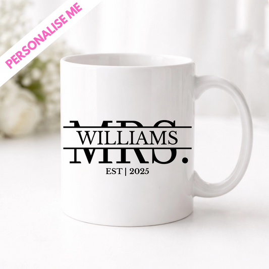 White mug with 'MR & MRS WILLIAMS EST 2025' text on a white background, personalise and let us print your design here in the UK using UVDTF.